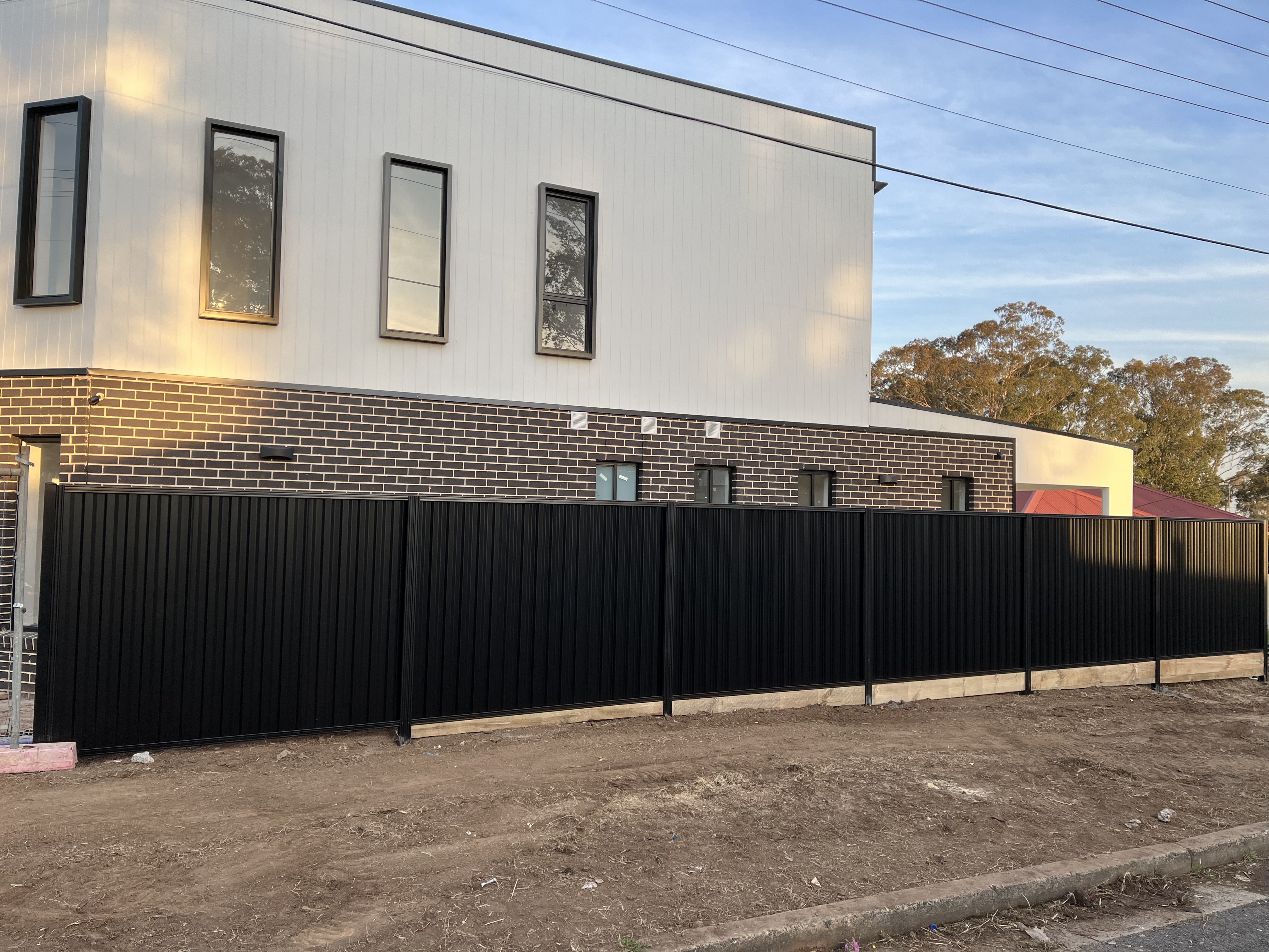 New Colorbond fence along duplex development frontage