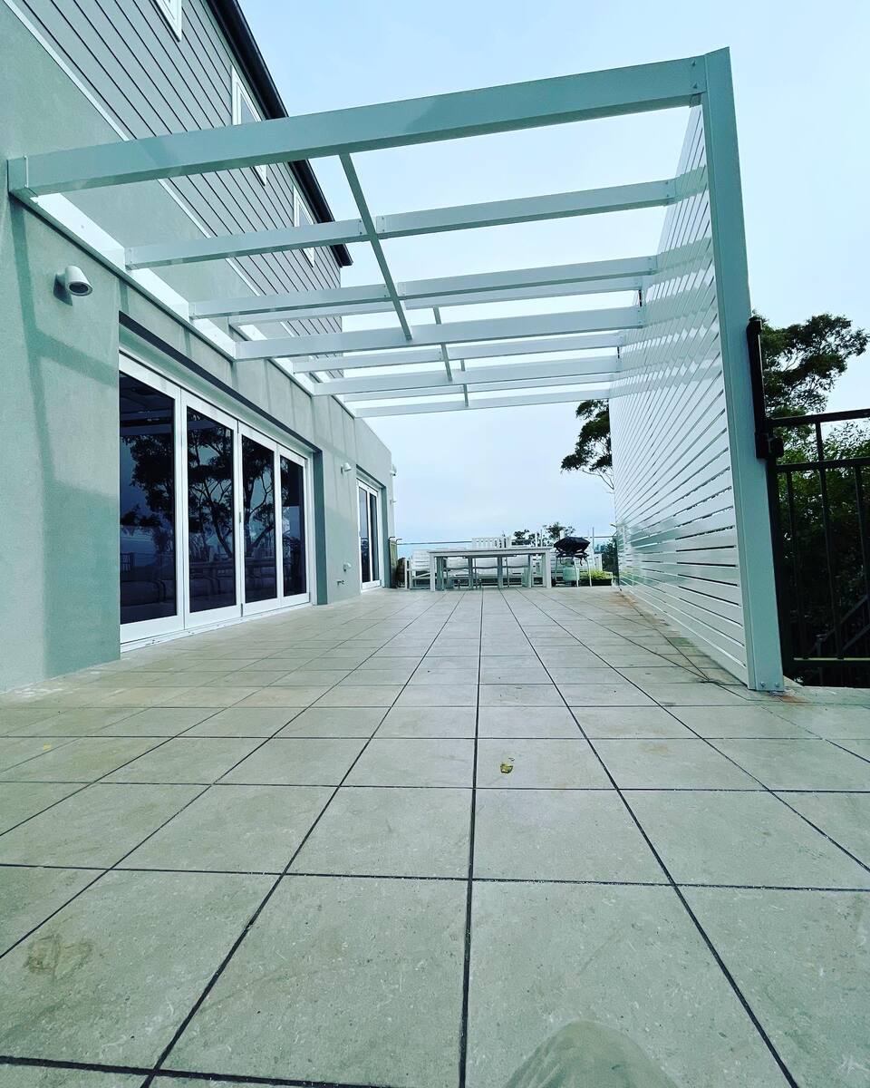 Completed white aluminium pergola with ocean view