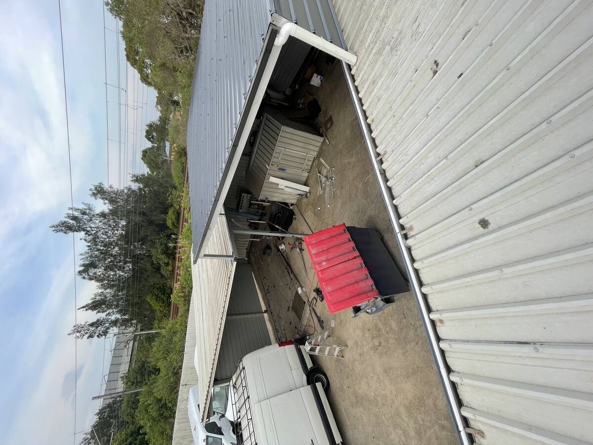 Industrial carport with attached shed roof view