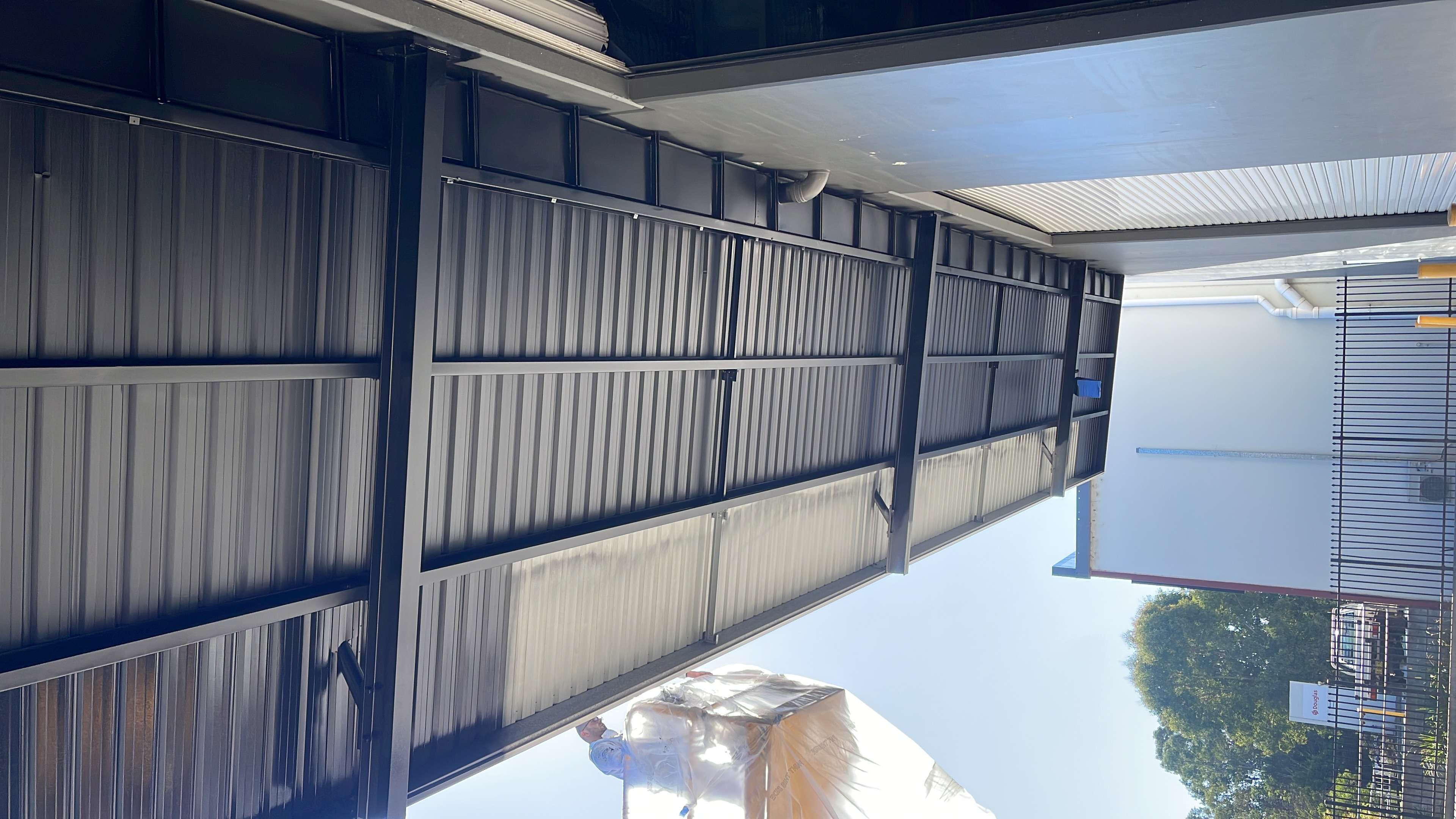 Underside of steel awning canopy structure during painting